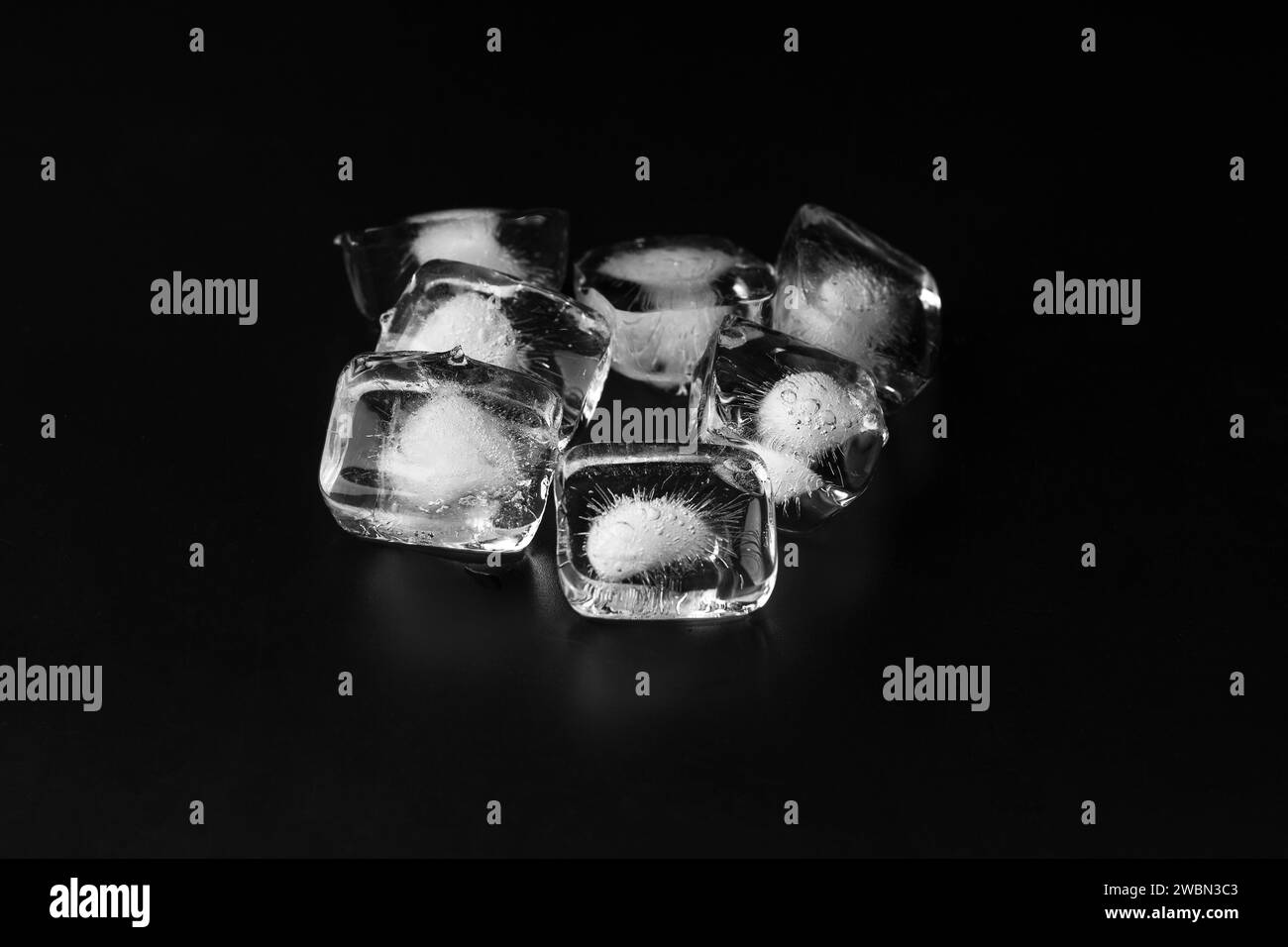 Ice cubes isolated on black background, copy space Stock Photo - Alamy