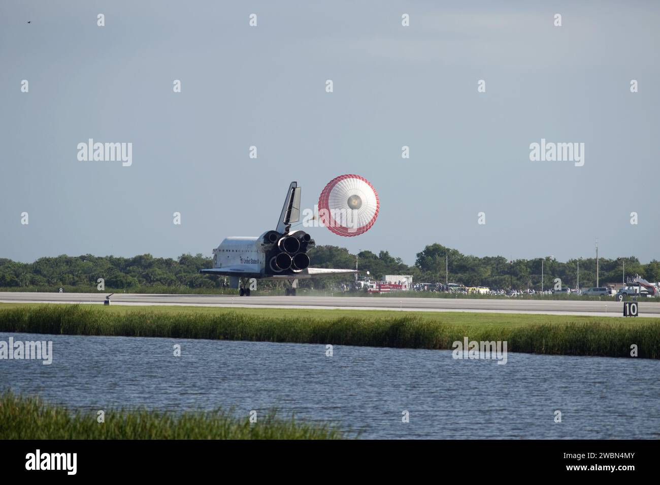 Space shuttle Atlantis deployed its drag chute to slow on Runway 33 at ...