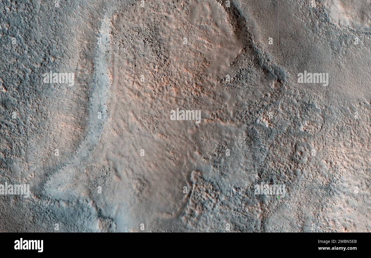 This color HiRISE view shows a pitted, blocky surface, but also more unusually, it has contorted, irregular features. Although there are impact craters in this area, some of the features (like in the lower center of the cutout) are too irregular to be relic impact craters or river channels. One possibility is that sedimentary layers have been warped from below to create these patterns. The freezing and thawing of subsurface ice is a mechanism that could have caused this. Acidalia Planitia is part of the northern plains of Mars, at a latitude of 44 degrees north. Stock Photo