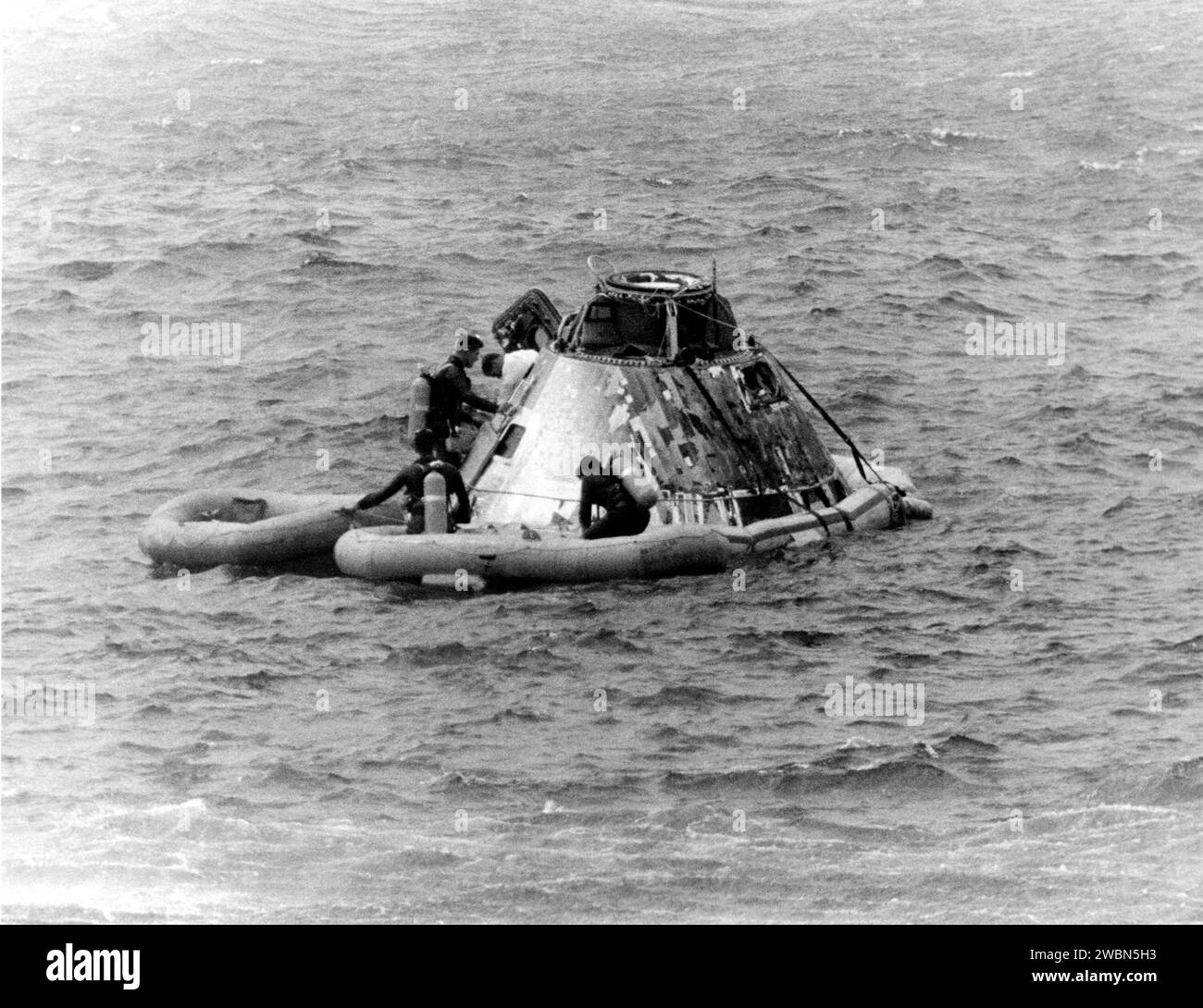KENNEDY SPACE CENTER, FLA. -- Pararescueman helps Apollo 9 Command Module Pilot David R. Scott from the spacecraft today during recovery at completion of the 10-day Earth orbital flight with James A. McDivitt and Russell L. Schweickart, still in the spacecraft. The astronauts splashed down less than five miles from the USS Guadalcanal, prime recovery ship, at the beginning of their 152nd revolution. During the highly successful flight, they extensively tested the lunar module spacecraft, paving the way for a similar one to carry Americans to the Moon later this year. They were lalunched March Stock Photo