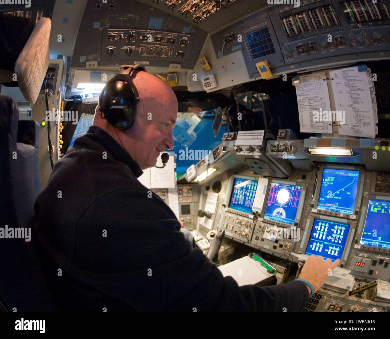 Shuttle Command Machine NASA astronaut Mark Kelly, STS-134 commander, operates the command ...