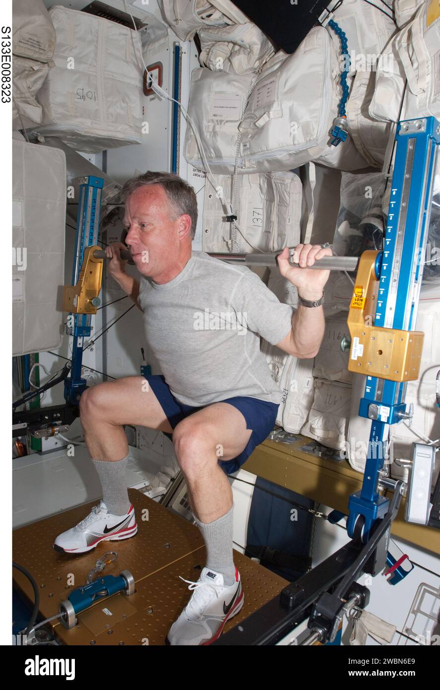 S133-E-008323 (3 March 2011) --- NASA astronaut Steve Lindsey, STS-133 commander, exercises using the advanced Resistive Exercise Device (aRED) in the Tranquility node of the International Space Station while space shuttle Discovery remains docked with the station. Stock Photo