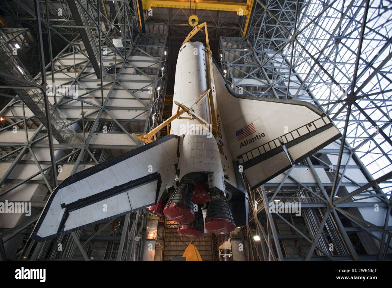 Atlantis is lifted in the Vehicle Assembly Building at Kennedy Space ...