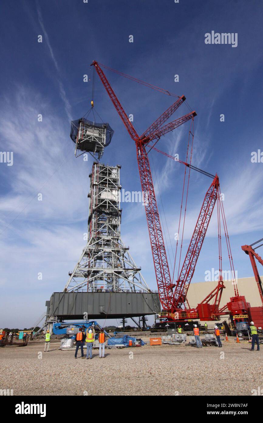 A crane at Kennedy Space Center positioned the seventh segment of a new ...