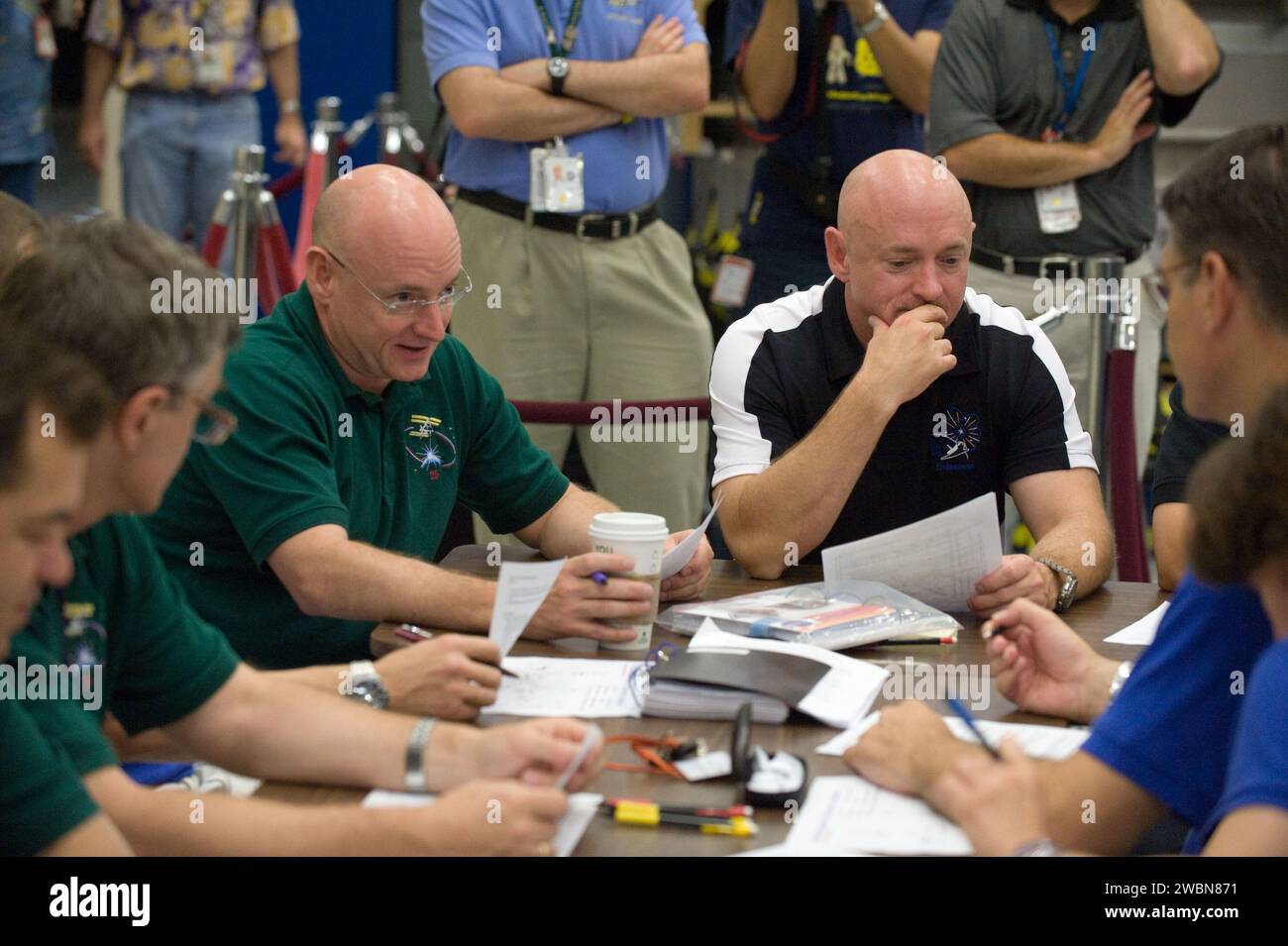 JSC2010-E-132377 (16 July 2010) --- NASA astronauts Scott Kelly (left), Expedition 25 flight engineer and Expedition 26 commander; and Mark Kelly, STS-134 commander, are pictured during an emergency scenarios training session in the Space Vehicle Mock-up Facility at NASA's Johnson Space Center. Stock Photo