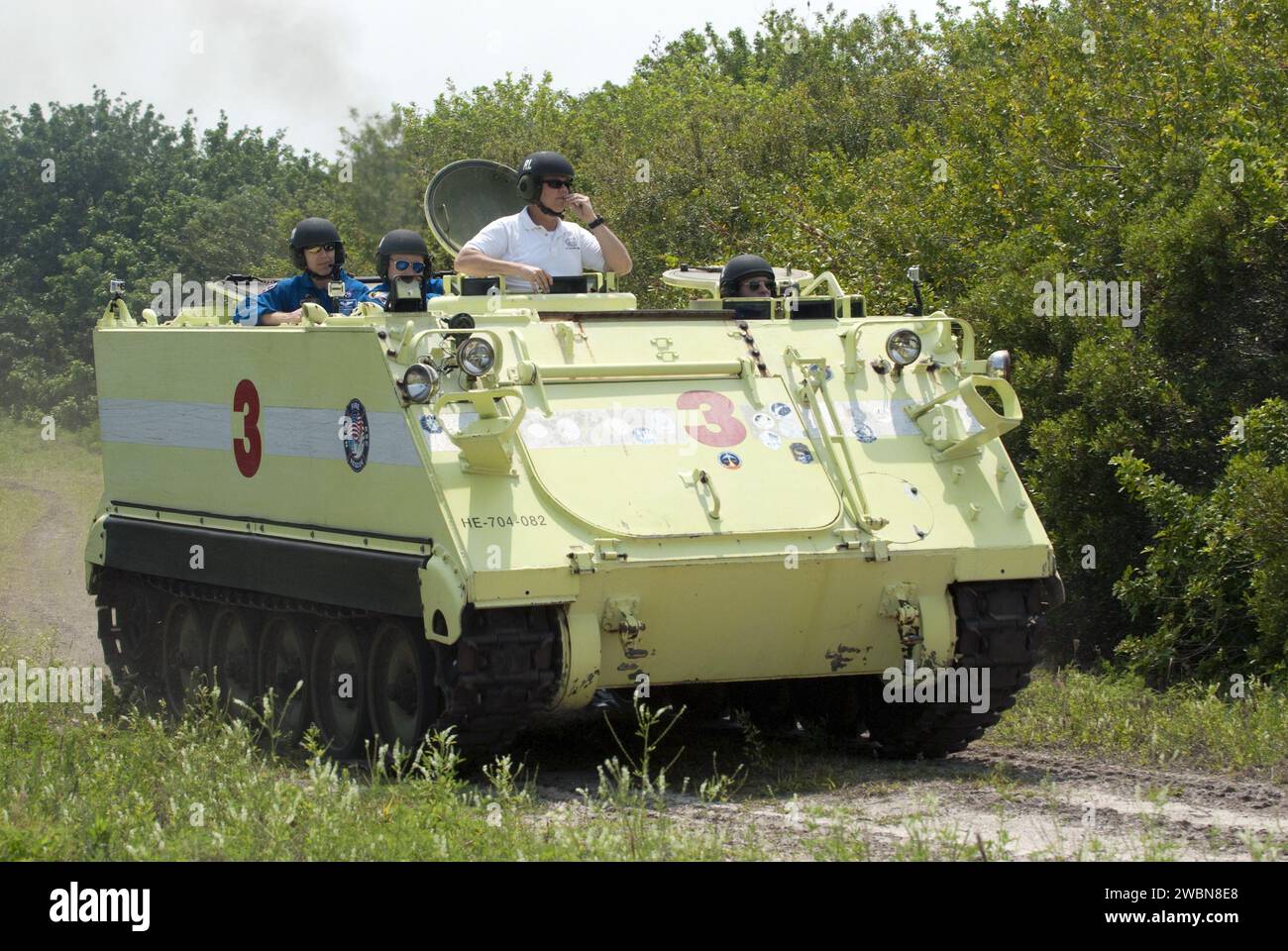 CAPE CANAVERAL, Fla. - Battalion Chief David Seymour provides supervision while space shuttle Endeavour's STS-134 crew members participate in M113 armored personnel carrier training at NASA's Kennedy Space Center in Florida. An M113 is kept at the foot of the launch pad in case an emergency exit from the pad is needed and every shuttle crew is trained on driving the vehicle before launch.      Space shuttle Endeavour's six crew members are at Kennedy for the launch countdown dress rehearsal called the Terminal Countdown Demonstration Test (TCDT) and related training. Targeted to launch April 1 Stock Photo