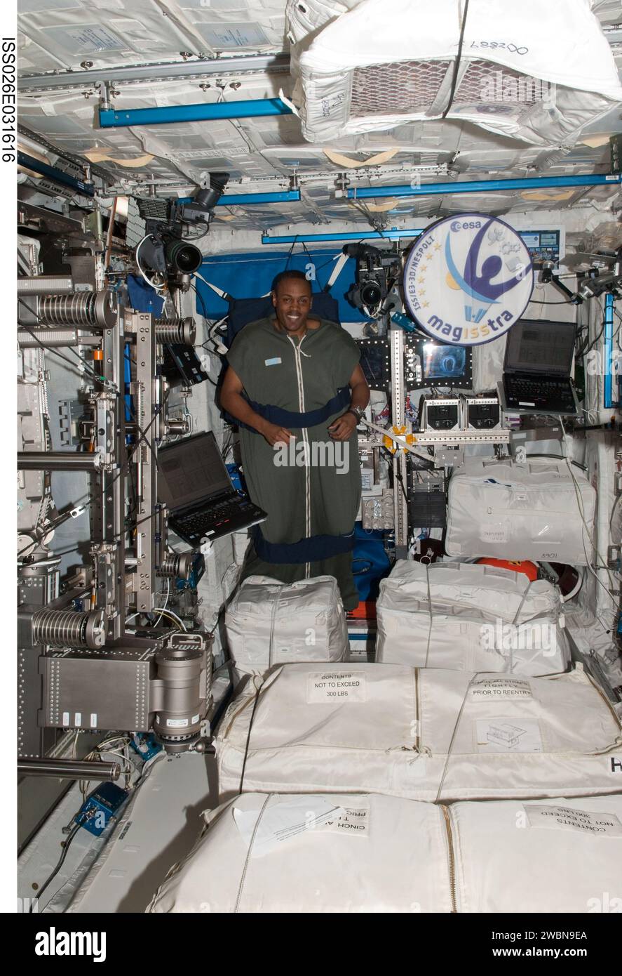 ISS026-E-031616 (3 March 2011) --- NASA astronaut Alvin Drew, STS-133 mission specialist, is pictured in his sleeping bag, which is attached in the Columbus laboratory of the International Space Station while space shuttle Discovery remains docked with the station. Stock Photo