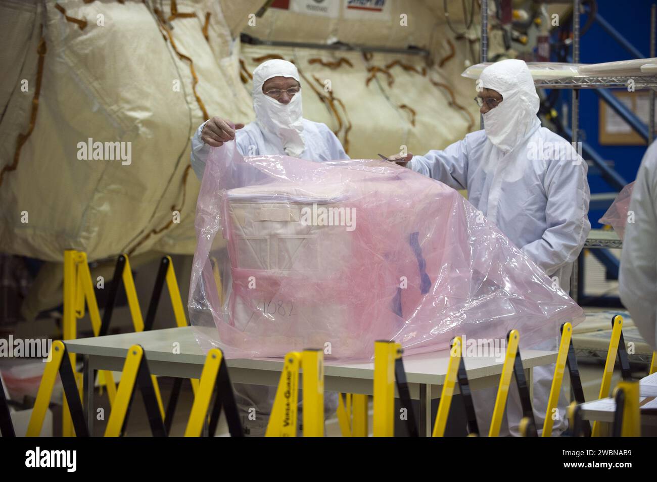 Supplies and cargo are prepared in Astrotech for installation in the ...