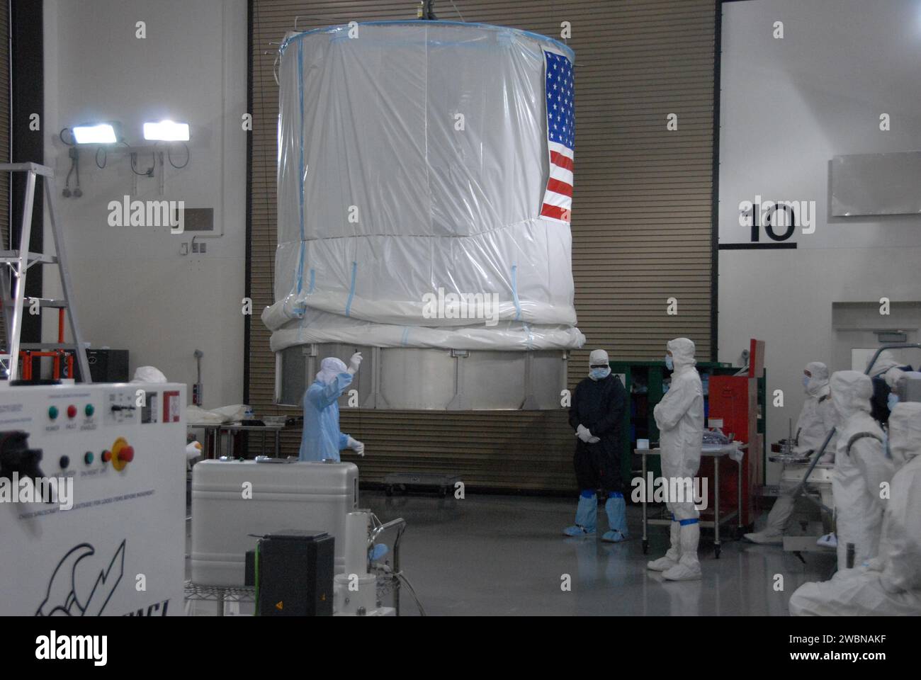 In a clean room inside the Astrotech Payload Processing Facility at