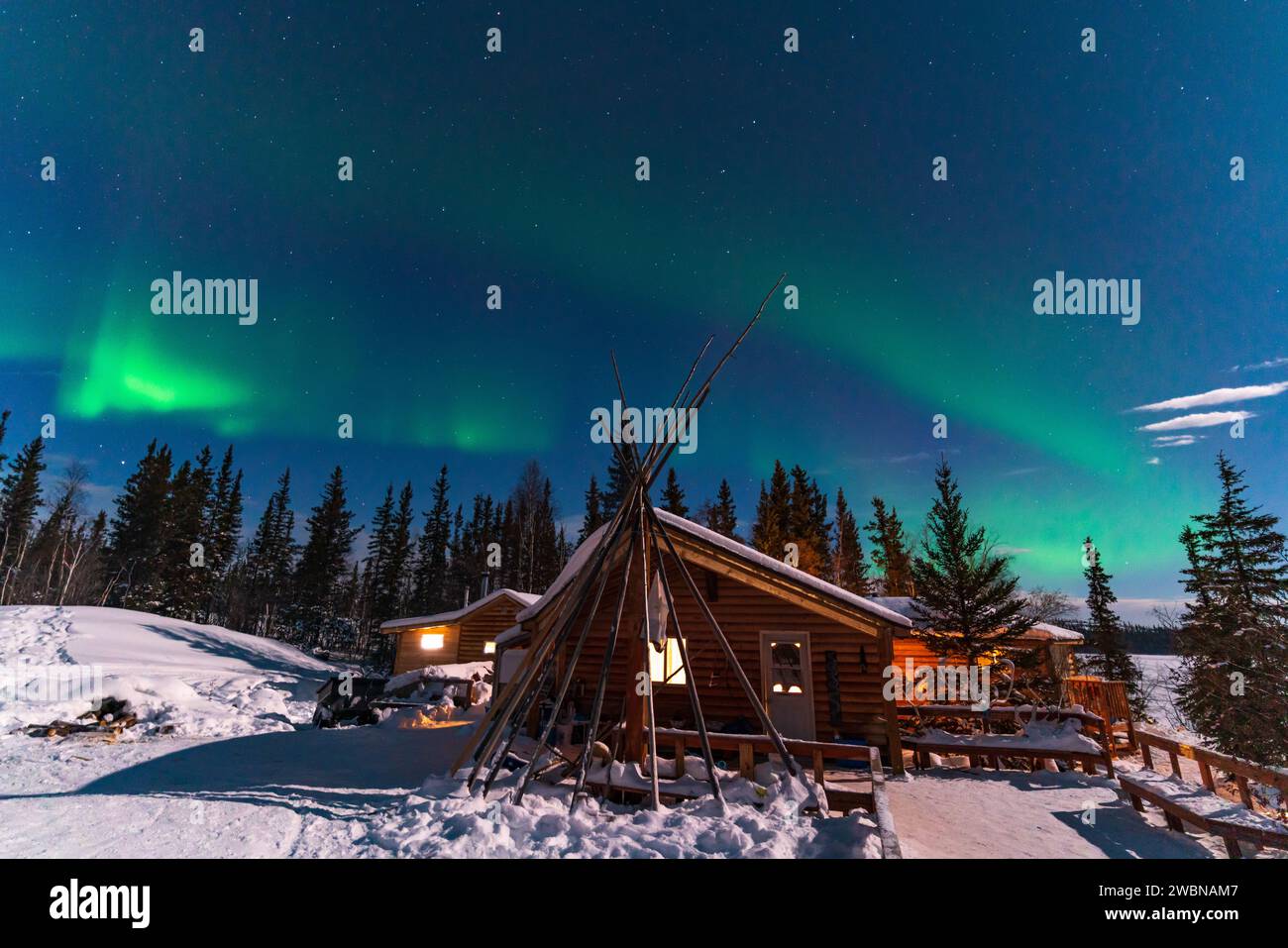 Aurora Borealis, Northern Lights, over aboriginal wooden cabin at