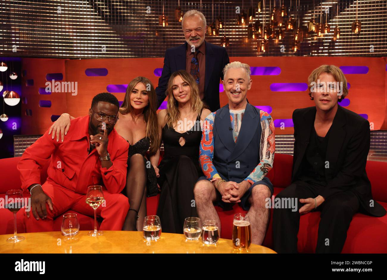 EDITORIAL USE ONLY Graham Norton (standing) with guests (left to right), Kevin Hart, Sofia Vergara, Jodie Comer, Alan Cumming and Tom Odell, during the filming for the Graham Norton Show at BBC Studioworks 6 Television Centre, Wood Lane, London, to be aired on BBC One on Friday evening. Picture date: Thursday January 11, 2024. Photo credit: Isabel Infantes/PA Wire Stock Photo