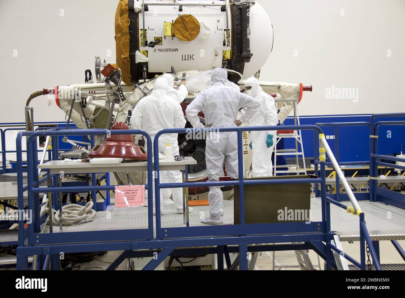 Workers in clean room attire at Port Canaveral prepared the Russian MRM ...