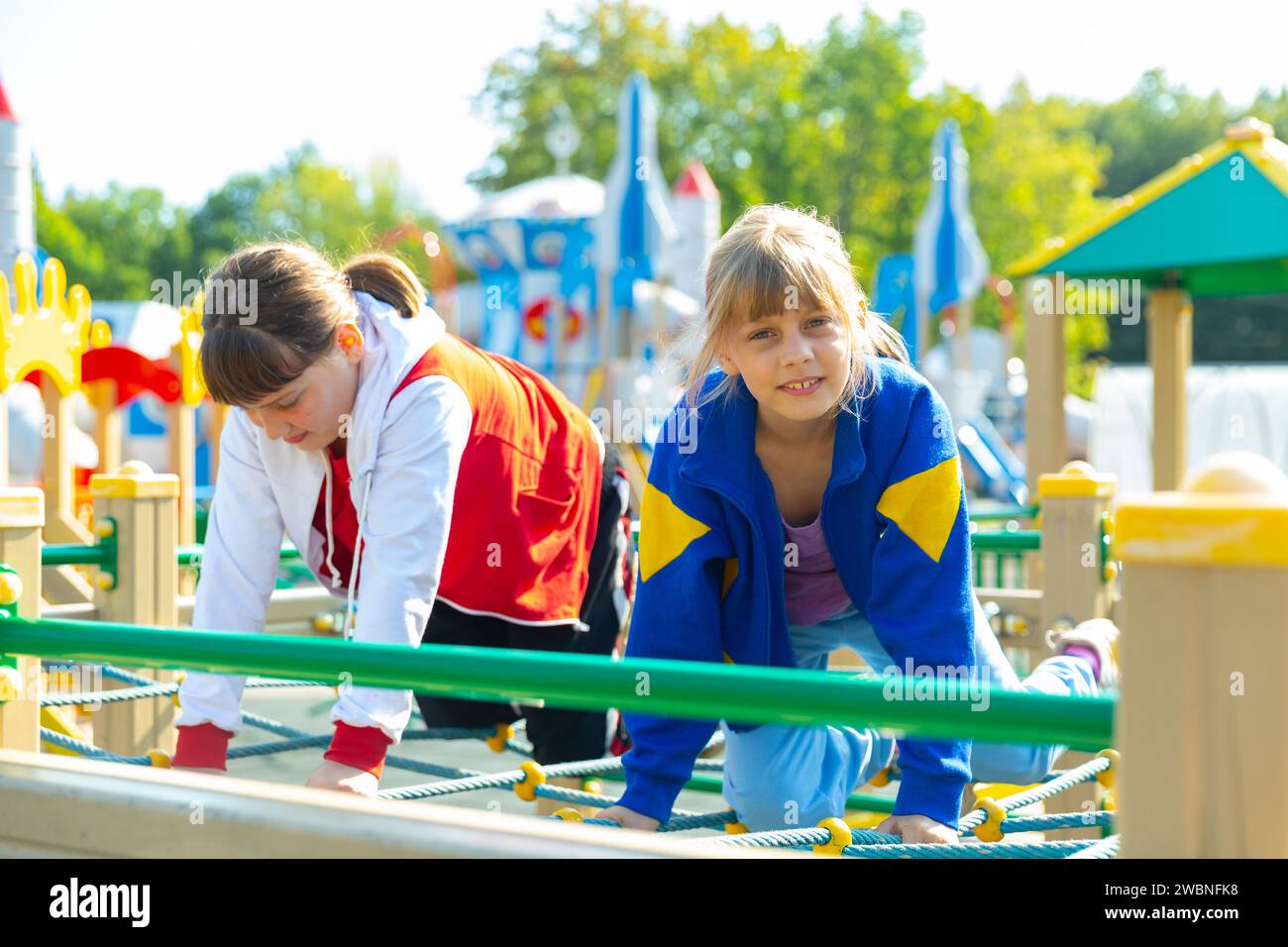 Two young girls on playground Stock Photo - Alamy