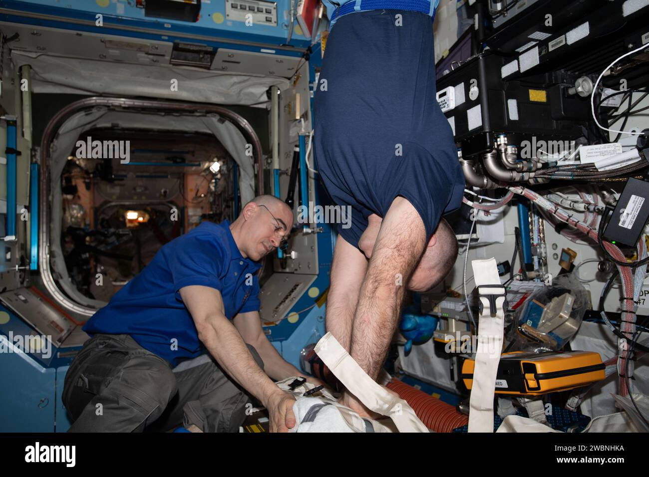 iss063e005099 (May 4, 2020) --- Roscosmos cosmonauts and Expedition 63 Flight Engineers (from left) Anatoly Ivanishin and Ivan Vagner practice chest compression techniques, or cardiopulmonary resuscitation (CPR), during an emergency training session. The crews aboard the International Space Station regularly train for a variety of emergency scenarios to stay familiar with medical hardware, safety gear and evacuation paths. Mission controllers on the ground also participate to maintain coordination and communication protocols. Stock Photo