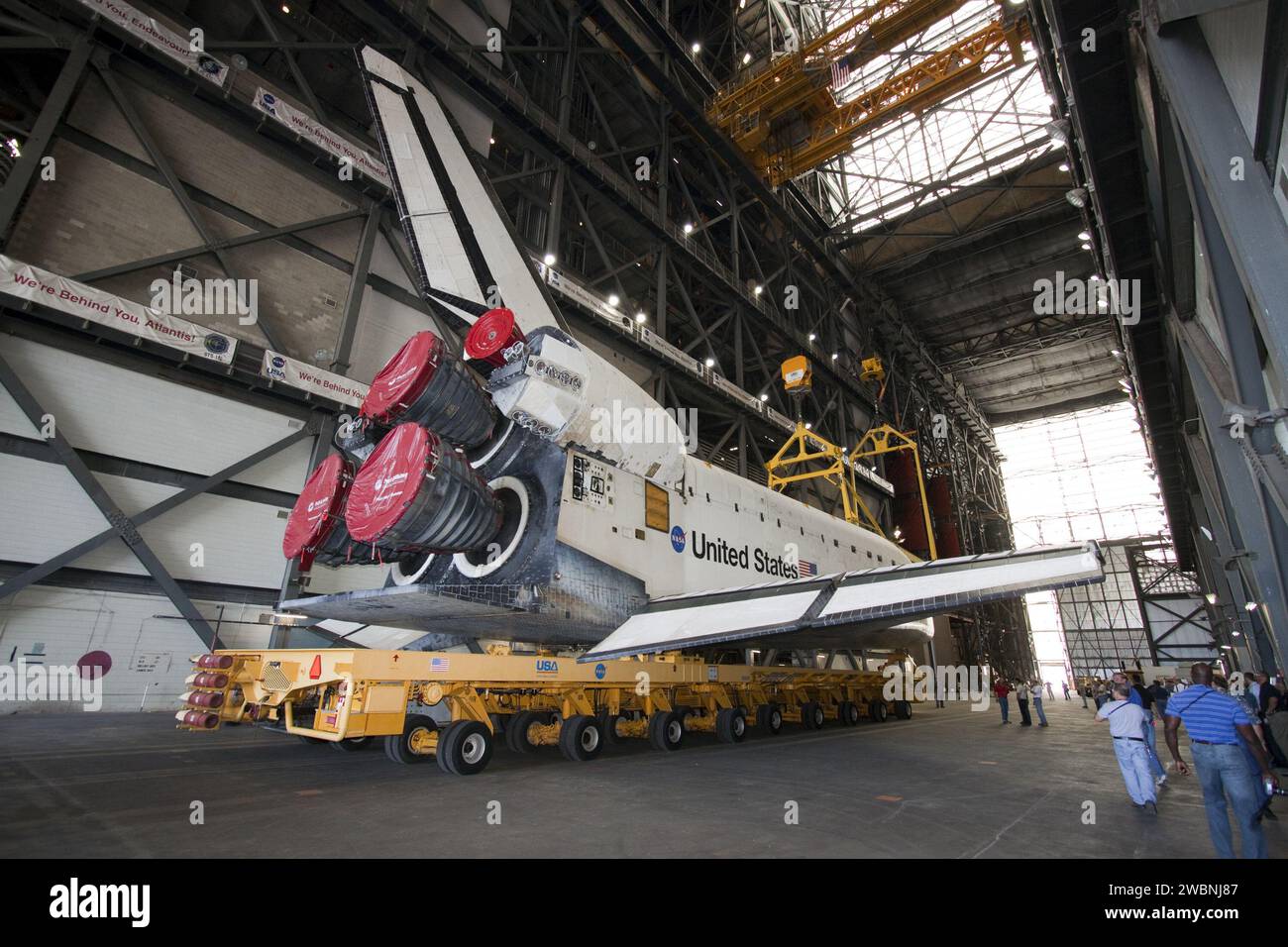 Space Shuttle Atlantis is positioned in the Vehicle Assembly Building ...