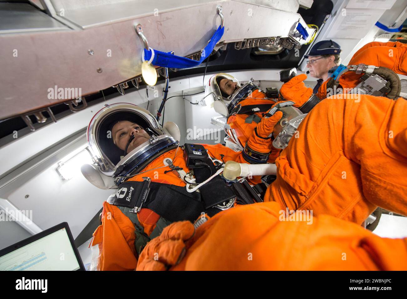 NASA engineers at Johnson Space Center tested crews inside an Orion spacecraft mockup using rotational hand controllers and cursor control devices while wearing Modified Advanced Crew Escape spacesuits on March 24, 2016. The devices allow operation of Orion’s displays and control systems for maneuvering and mission tasks, providing data to ensure astronauts can properly use the controls in their suits. Stock Photo