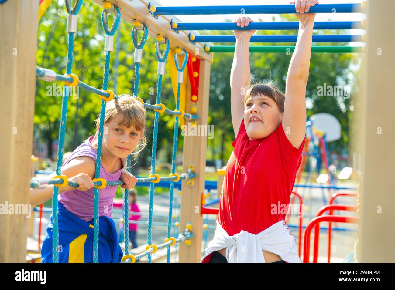 Two young girls on playground Stock Photo - Alamy