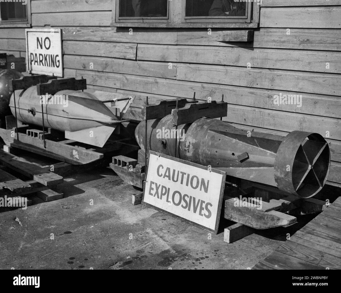 Captured depth charges and torpedoes are shown on Pier X. They were taken off the HR-674 at the North Side of Pier X, HRPE, Newport News, Virginia. Official Photograph U.S. Army Signal Corps, Hampton Roads Port of Embarkation, Newport News Virginia, September 1944 Stock Photo