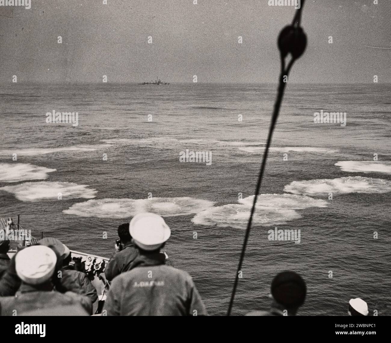 Off Point Judith, Rhode Island, crewmen of the Coast Guard-manned Frigate USS MOBERLY watch the surface boil as a pattern of depth charges scores the final kill in the long, uphill battle against Nazi vessels, the Coast Guard ship destroyed the submarine on Sunday, May 6, 1945. The MOBERLY operates as a unit of the Atlantic fleet. Stock Photo