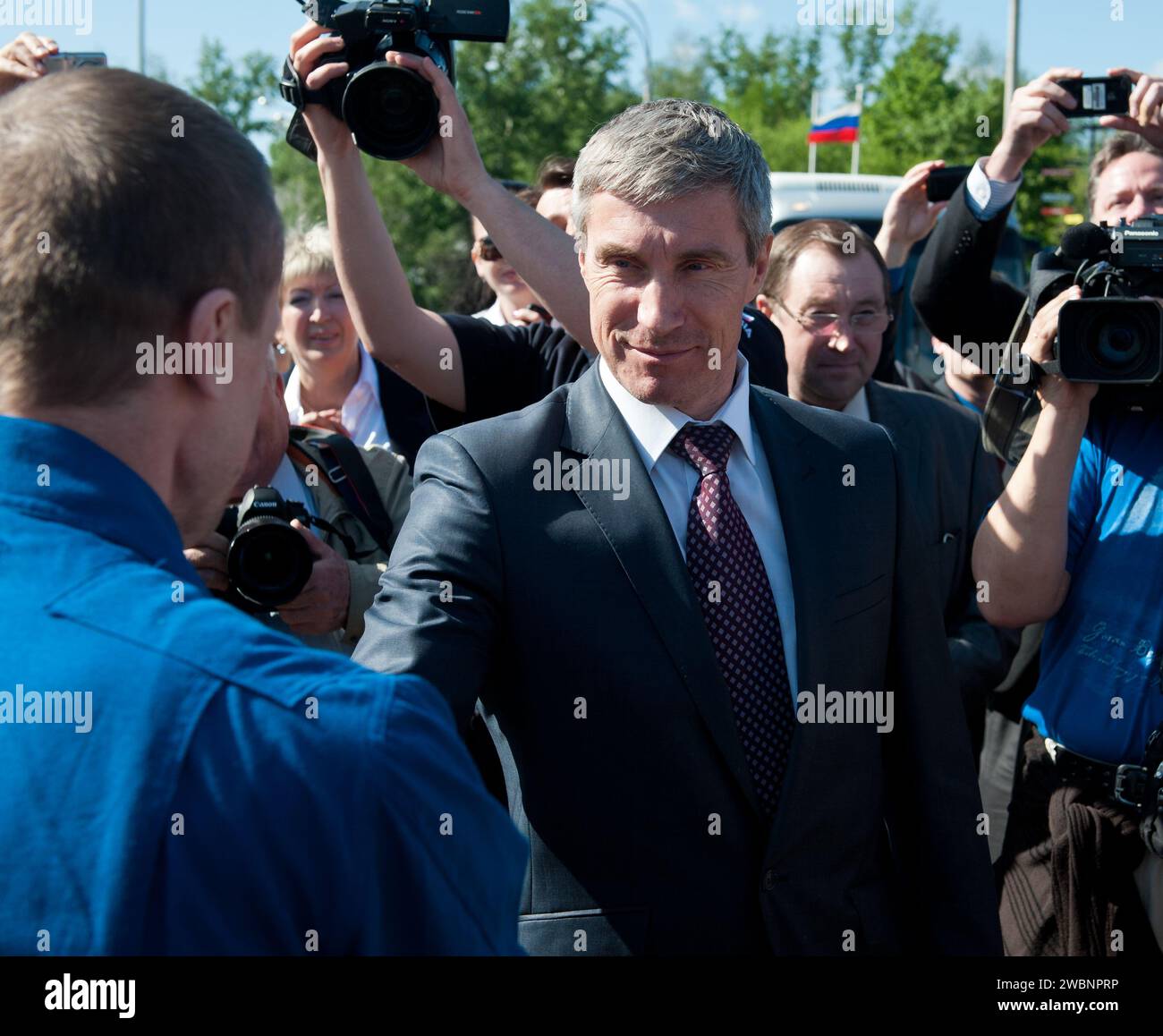 Chief, Gagarin Cosmonaut Training Center, Sergei Krikalev shakes hands ...
