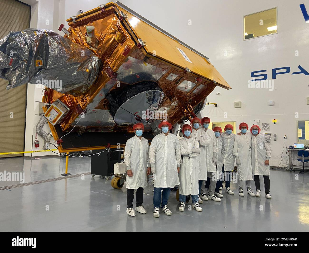 Sentinel-6 Michael Freilich team members from European Space Agency pose with the spacecraft during processing. Launch is scheduled for Nov. 11, 2020 from Vandenberg Air Force Base in California. NASA’s Launch Services Program based at Kennedy Space Center is responsible for launch management. Stock Photo