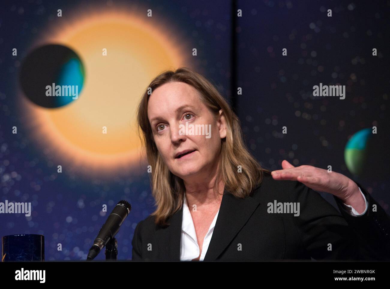 Debra Fischer, a professor of Astronomy at Yale University, speaks during a news conference, Wednesday, Feb. 2, 2010, at NASA Headquarters in Washington. Scientists using NASA's Kepler, a space telescope, recently discovered six planets made of a mix of rock and gases orbiting a single sun-like star, known as Kepler-11, which is located approximately 2,000 light years from Earth. Stock Photo