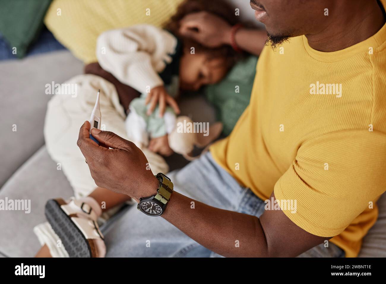 Father taking childs temperature stock photo alamy