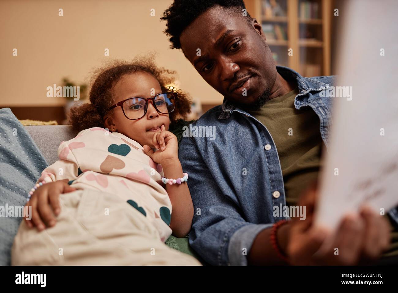 Daughter and Dad Reading Bedtime Stories Stock Photo