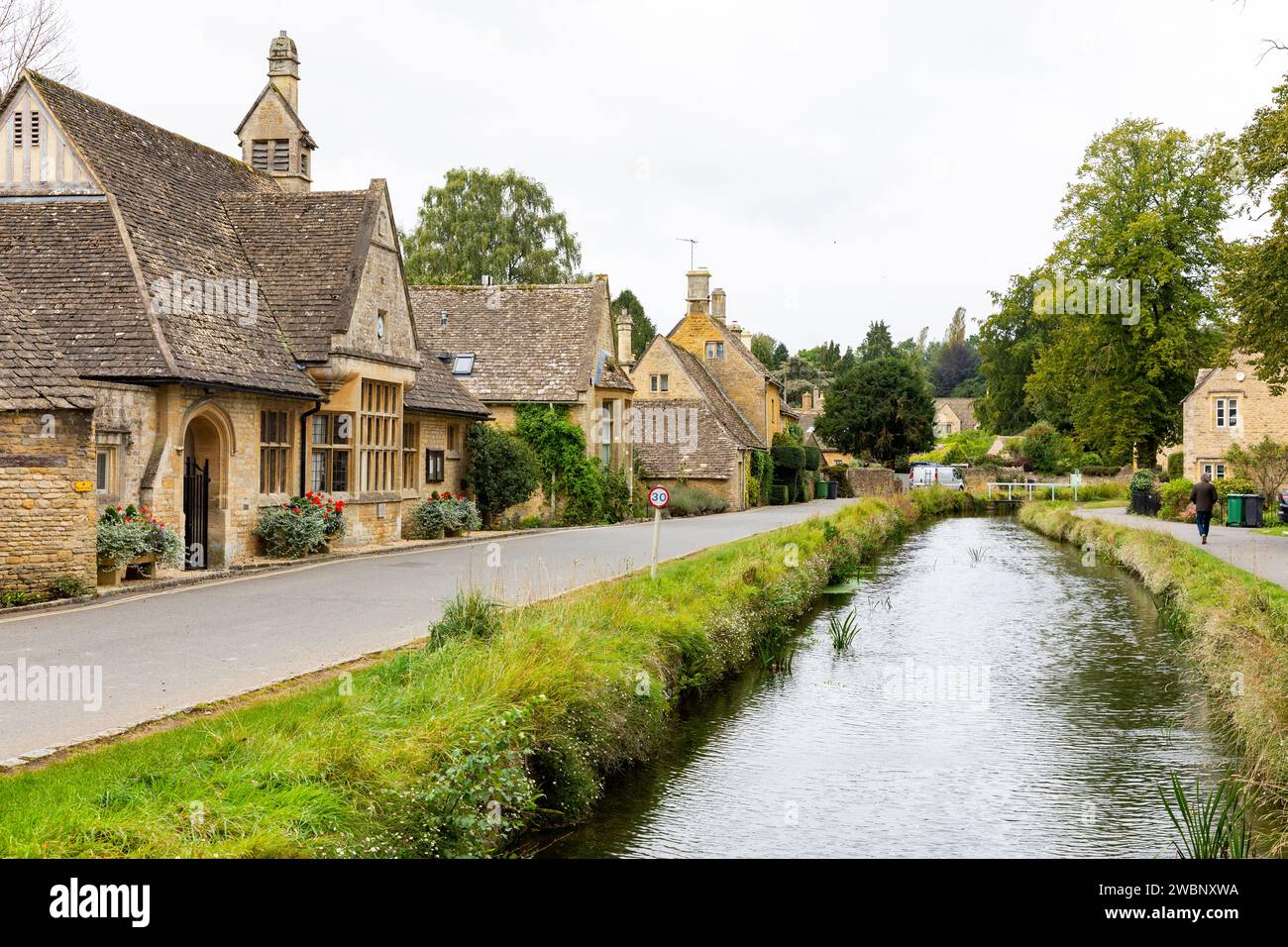 Cotswolds village of Lower Slaughter, stone built homes alongside river