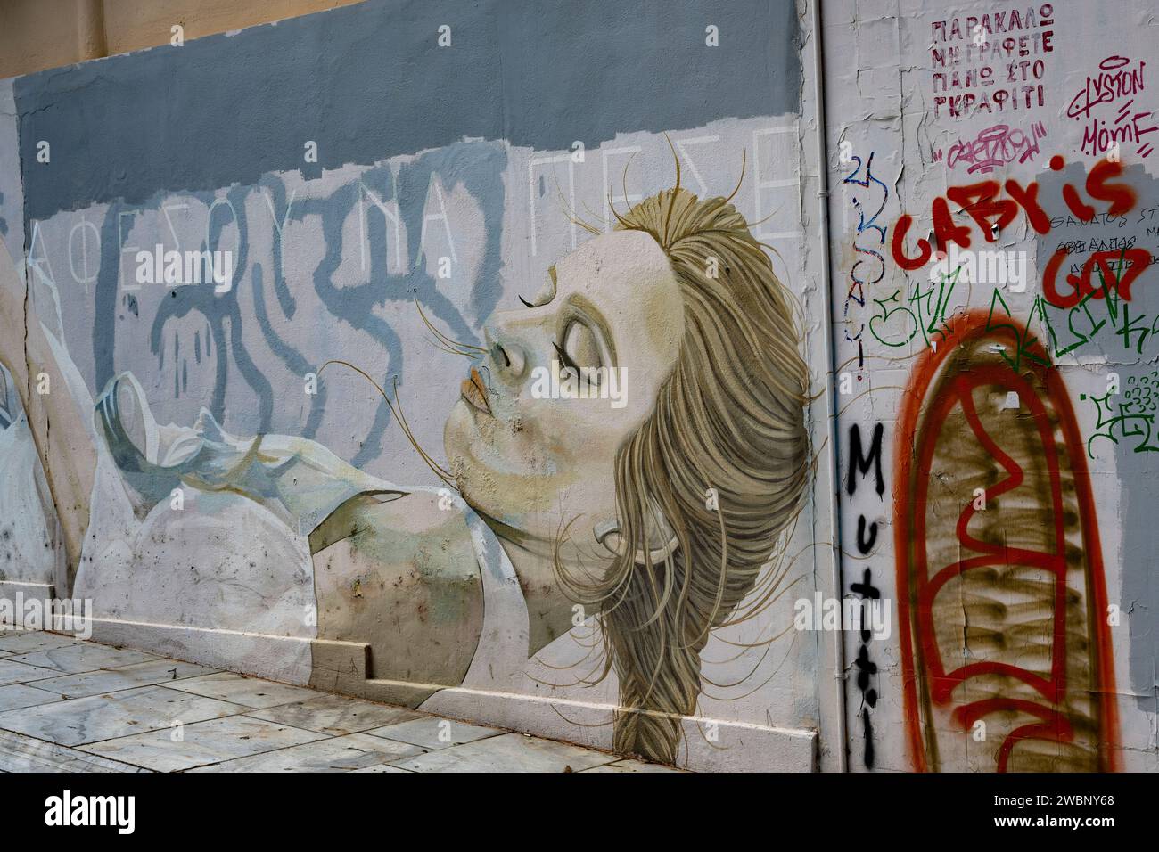 Sketch of a woman on an exterior building wall in Athens, Greece Stock Photo
