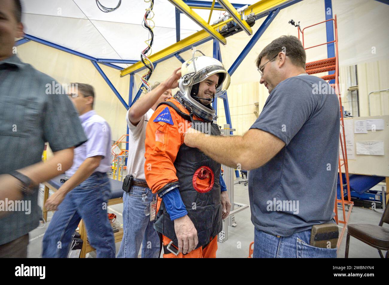 Astronaut Rex Walheim evaluates the Orion Crew Survival System suit ...