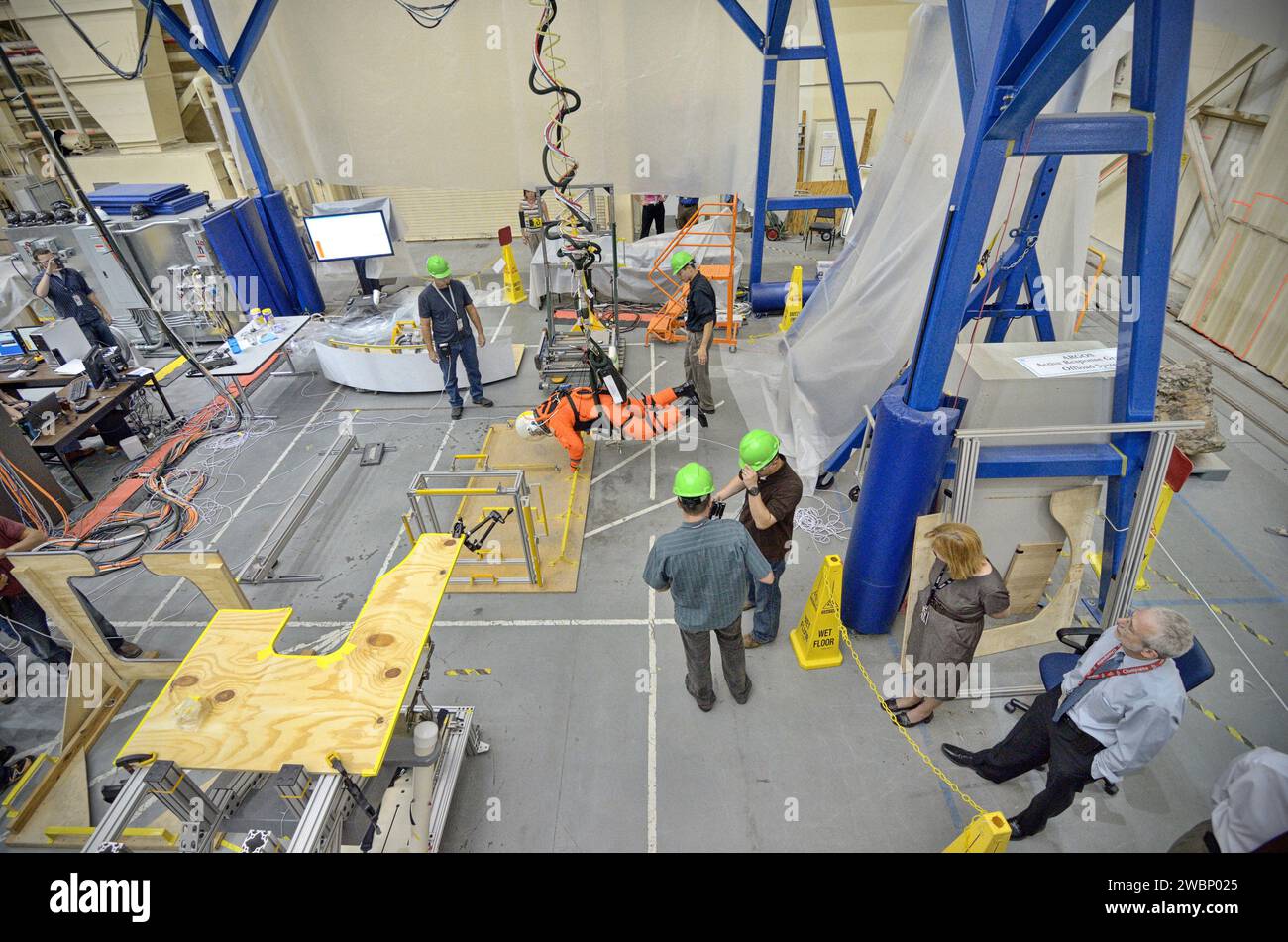 Astronaut Rex Walheim conducts tests of the Orion Crew Survival System ...