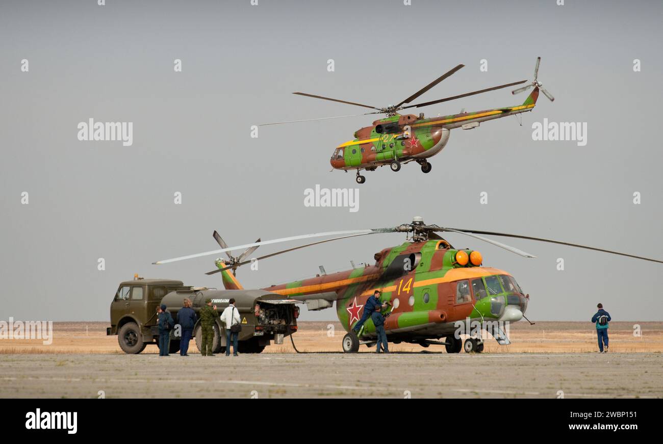 Russian search and rescue helicopters refuel in Arkalyk, Kazakhstan prior to the landing of the Soyuz TMA-18 spacecraft with Expedition 24 Commander Alexander Skvortsov and Flight Engineers Tracy Caldwell Dyson and Mikhail Kornienko on Saturday, Sept. 25, 2010.  Russian Cosmonauts Skvortsov and Kornienko and NASA Astronaut Caldwell Dyson, are returning from six months onboard the International Space Station where they served as members of the Expedition 23 and 24 crews. Stock Photo
