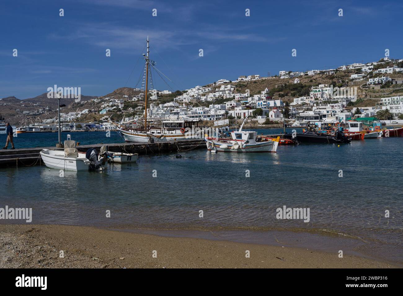 Boats in a harbor along the Mykonos Island coastline, Greece Stock Photo