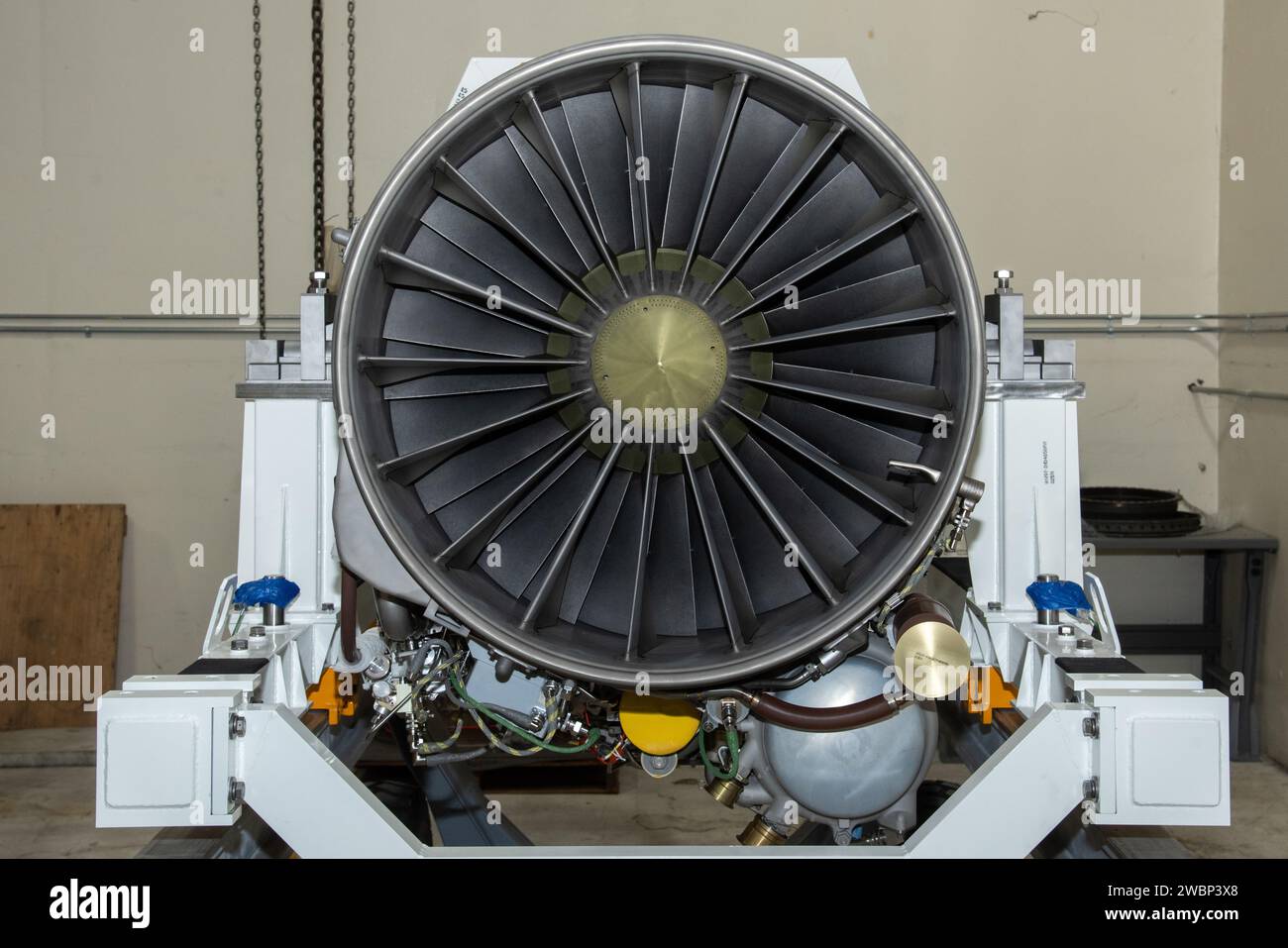 The F414-GE-100 engine, which will power NASA’s X-59 Quiet SuperSonic Technology X-plane (QueSST) in flight, is unboxed at NASA’s Armstrong Flight Research Center in Edwards, California. The engine, one of two delivered by GE, is approximately 13 feet long, and will power X-59 on missions to gather information about how the public perceives the sounds of quieter supersonic flight. Stock Photo