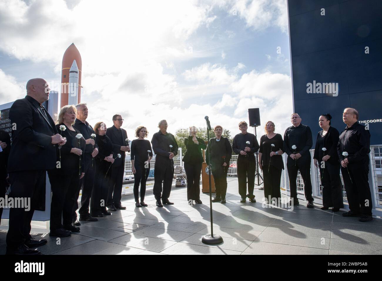 Members of the Space Coast Voices sing the National Anthem during the NASA Day of Remembrance ceremony at the Space Mirror Memorial in the Kennedy Space Center Visitor Complex on Jan. 30, 2020. The crews of Apollo 1 and space shuttles Challenger and Columbia, as well as other fallen astronauts who lost their lives in the name of space exploration and discovery, were honored at the annual event. Stock Photo