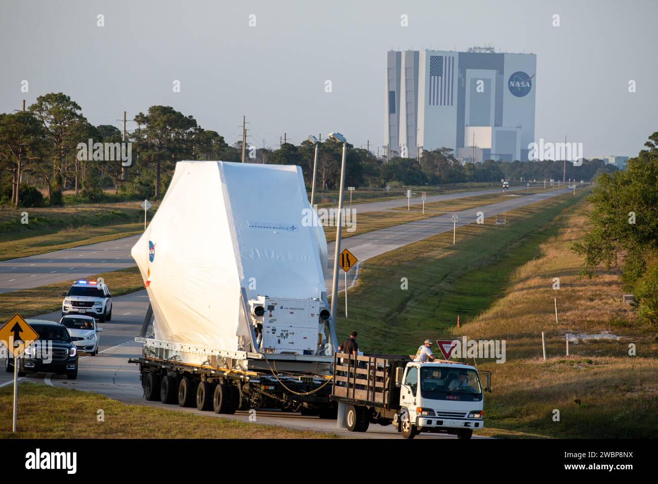 NASA’s Orion spacecraft, protected in its shipping container, is loaded onto a transporter at the Launch and Landing Facility at Kennedy Space Center for its move to the Neil Armstrong Operations and Checkout Building on March 25, 2020. After testing at NASA’s Plum Brook Station in Ohio verified it can handle the extreme conditions of a deep-space environment, the spacecraft – carried by the agency’s Super Guppy aircraft – has returned to the Florida spaceport for final testing and assembly. Following this, Orion will be integrated with the Space Launch System rocket for Artemis I – the first Stock Photo