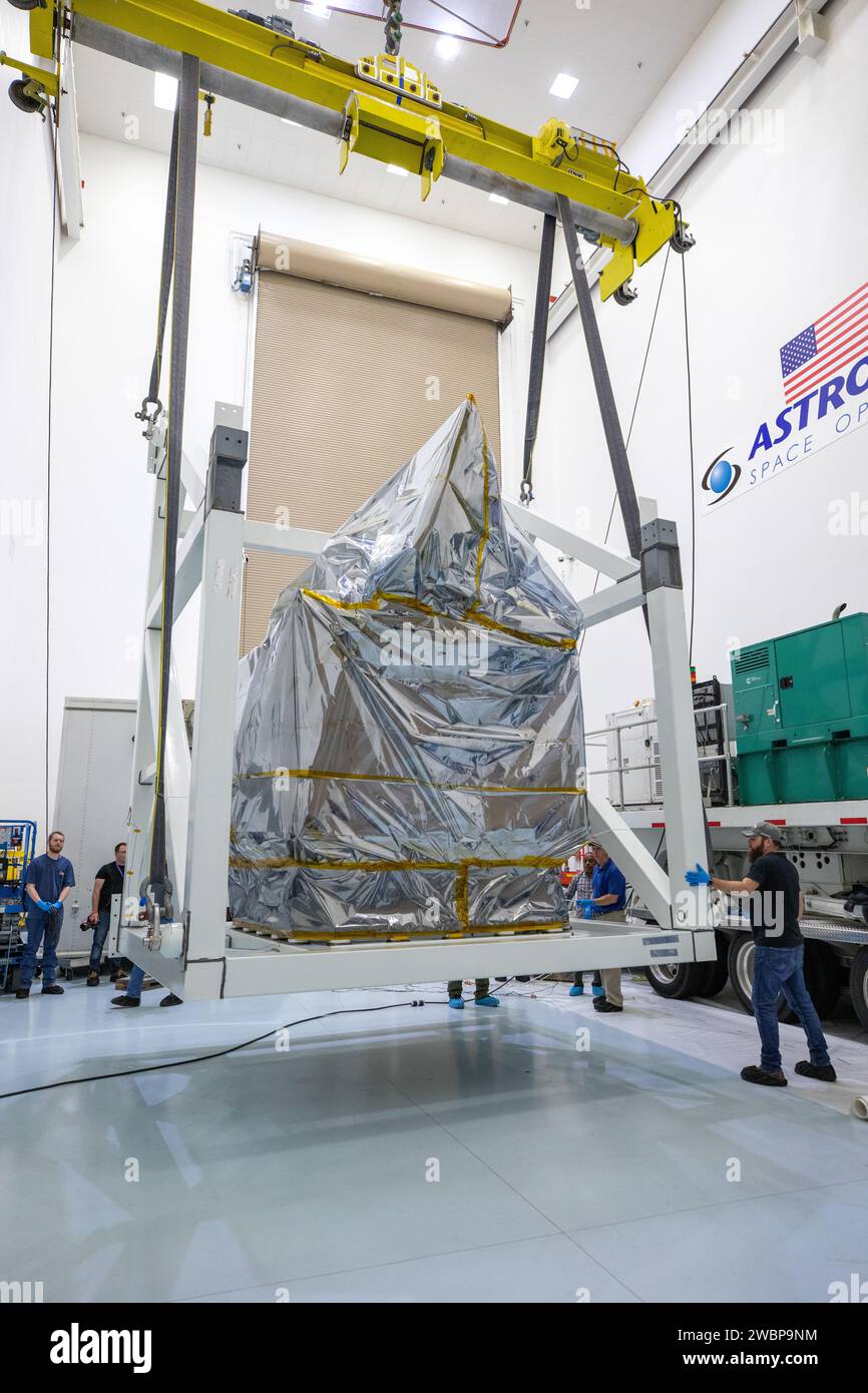 Technicians Monitor Movement As A Crane Hoists NASA s Plankton Aerosol Technicians Monitor Movement As A Crane Hoists NASA s Plankton Aerosol