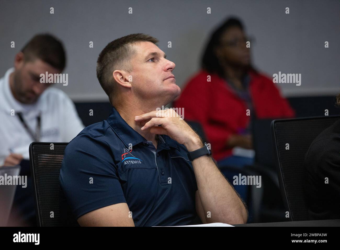 Artemis II crew member CSA (Canadian Space Agency) astronaut Jeremy Hansen participates in a pre-task briefing on Tuesday, Sept. 19, 2023, held in the Rocco A. Petrone Launch Control Center at NASA’s Kennedy Space Center in Florida. The briefing allows teams to collaborate ahead of a series of integrated system verification and validation tests conducted at Kennedy to evaluate the readiness of the crew and ground equipment ahead of launch day. Stock Photo