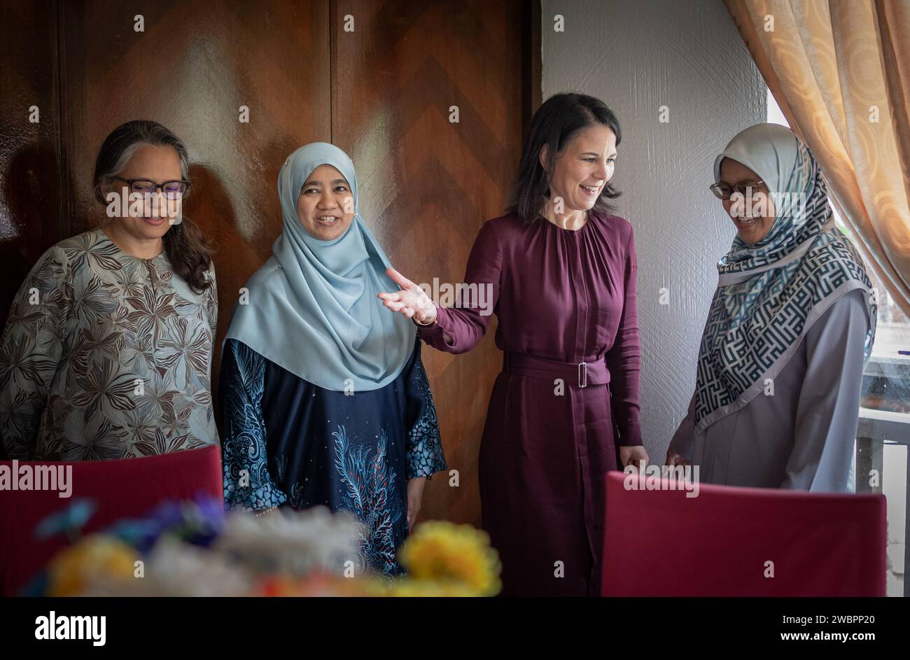 Kuala Lumpur, Malaysia. 12th Jan, 2024. Annalena Baerbock (2nd from right, Bündnis90/Die Grünen), Foreign Minister, takes part in a discussion with representatives of Muslim organizations in Malaysia with (l-r) Rozana Isa (Sisters in Islam), Hanim Bin Salleh (IKRAM) and Fatin Nur Majdina Binti Nord. Credit: Michael Kappeler/dpa/Alamy Live News Stock Photo