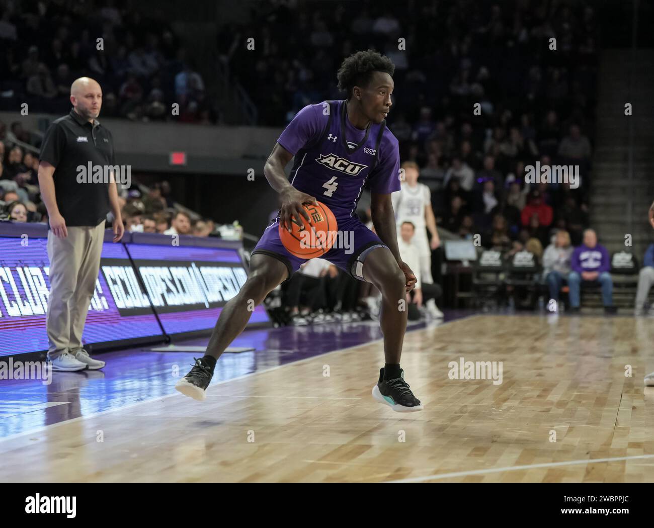 Abilene Christian Wildcats guard Kavion McClain (4) dribbles the ball at the top of the key during the second quarter NCAA basketball game against Abilene Christian in Phoenix, Arizona, Thursday, January 11th, 2024. GCU defeated Abilene Christian 74-64.  (David Venezia/Image of Sport) Stock Photo