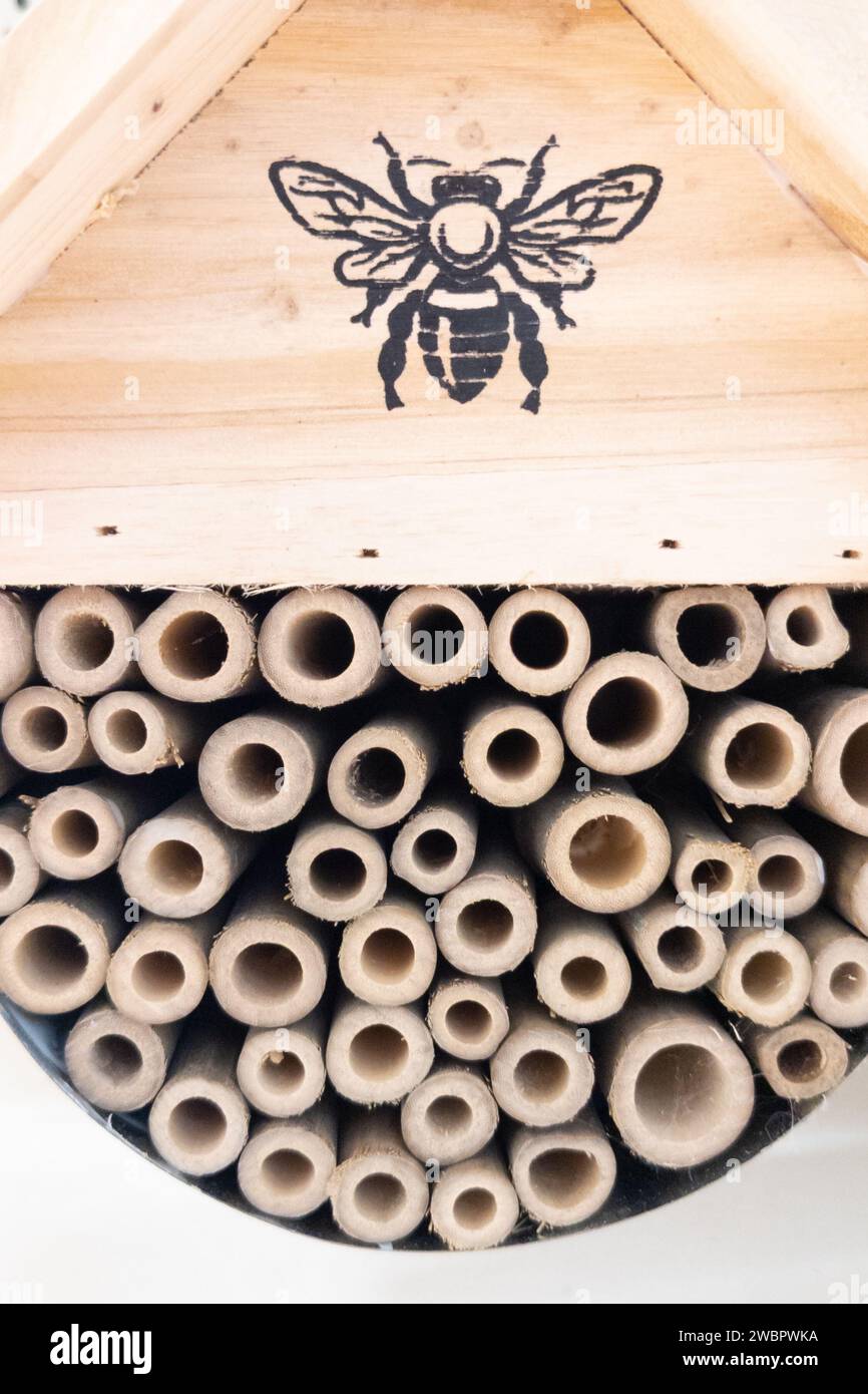 insect hotel french text in wooden hut for butterfly bee and bug hotel animals Stock Photo