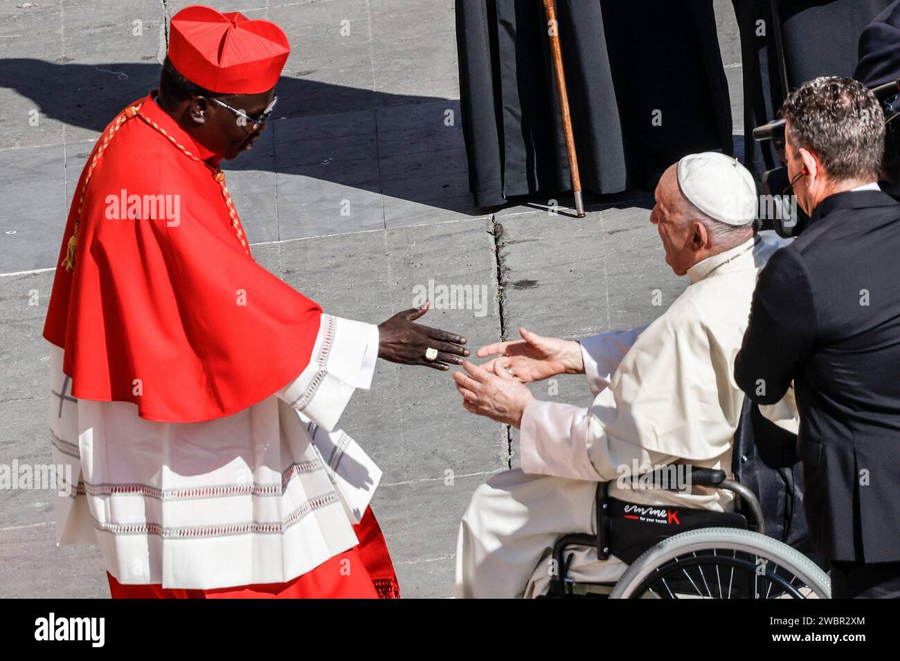 New cardinal Stephen Ameyu Martin Mulla greets Pope Francis at the end