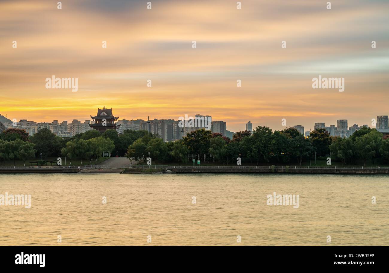 Dusk along the Xiangjiang River, cityscape of Changsha, China. Stock Photo