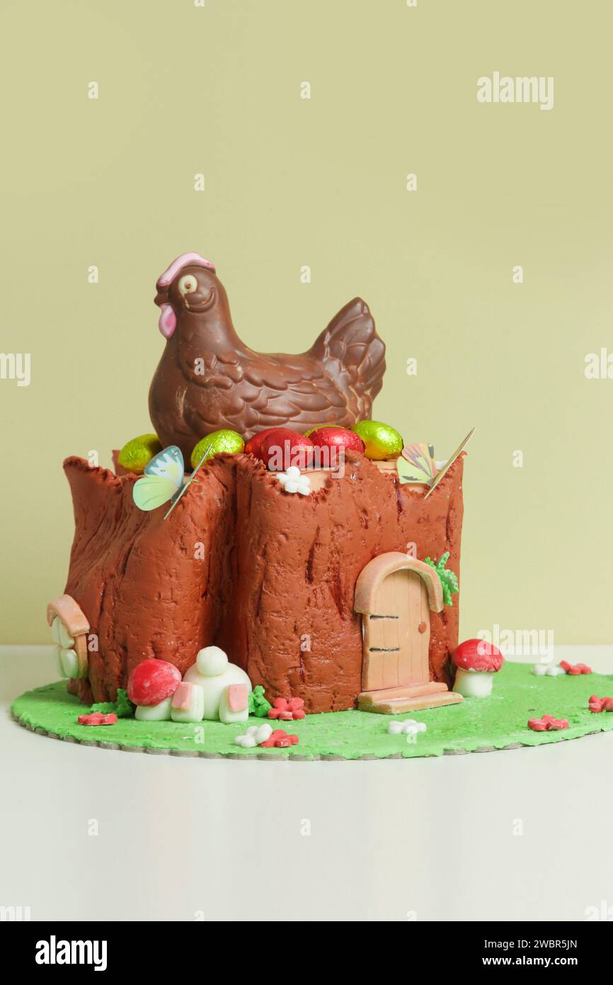 Easter log cake with textured look on the tree trunk and Easter bunny Stock Photo