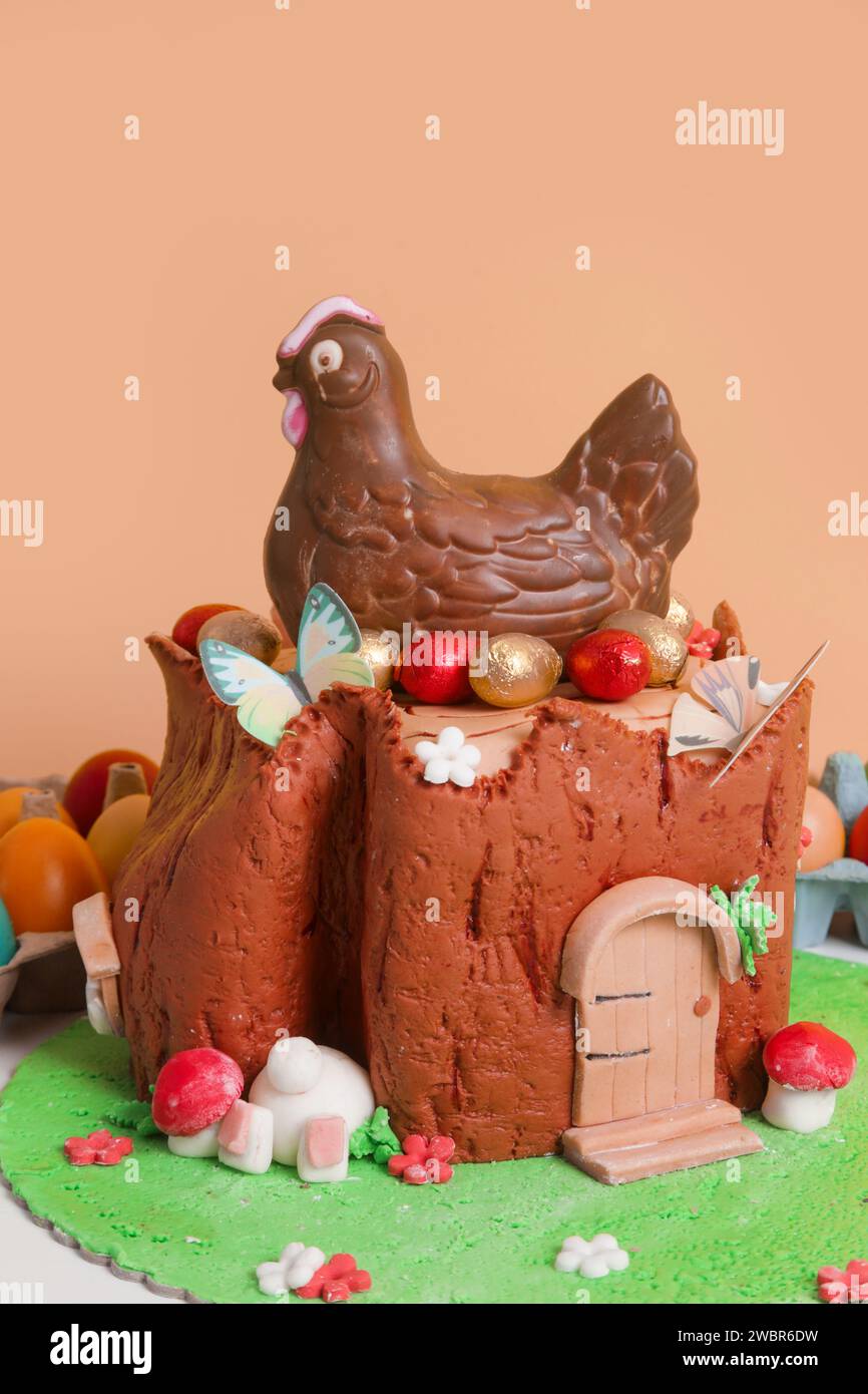 Easter log cake with textured look on the tree trunk and Easter bunny Stock Photo