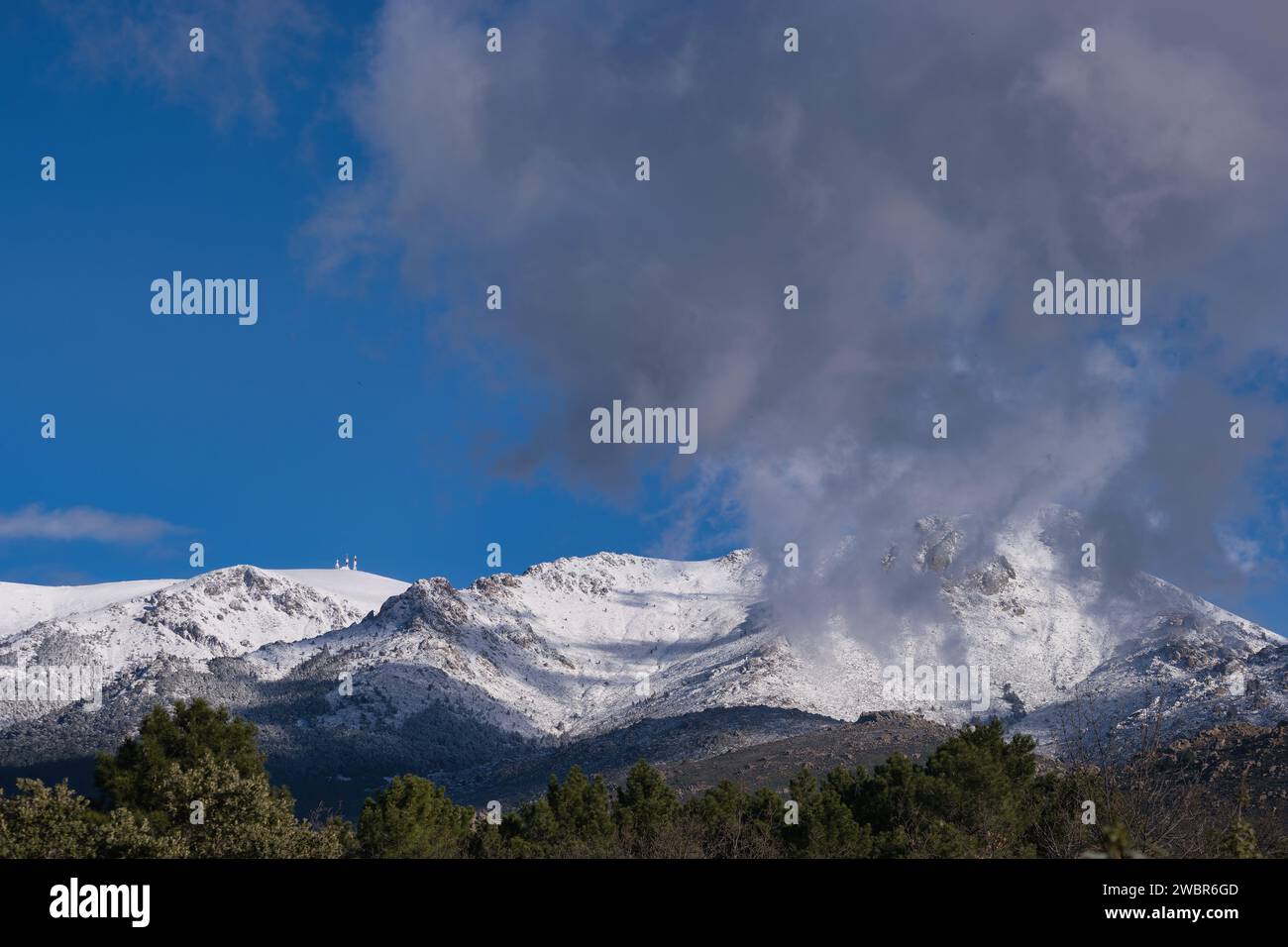 ...View of the Sierra de Guadarrama mountain range near Madrid in Spain with winter sky in the background Stock Photo