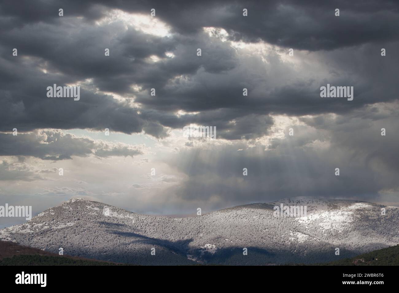 ...View of the Sierra de Guadarrama mountain range near Madrid in Spain with winter sky in the background Stock Photo