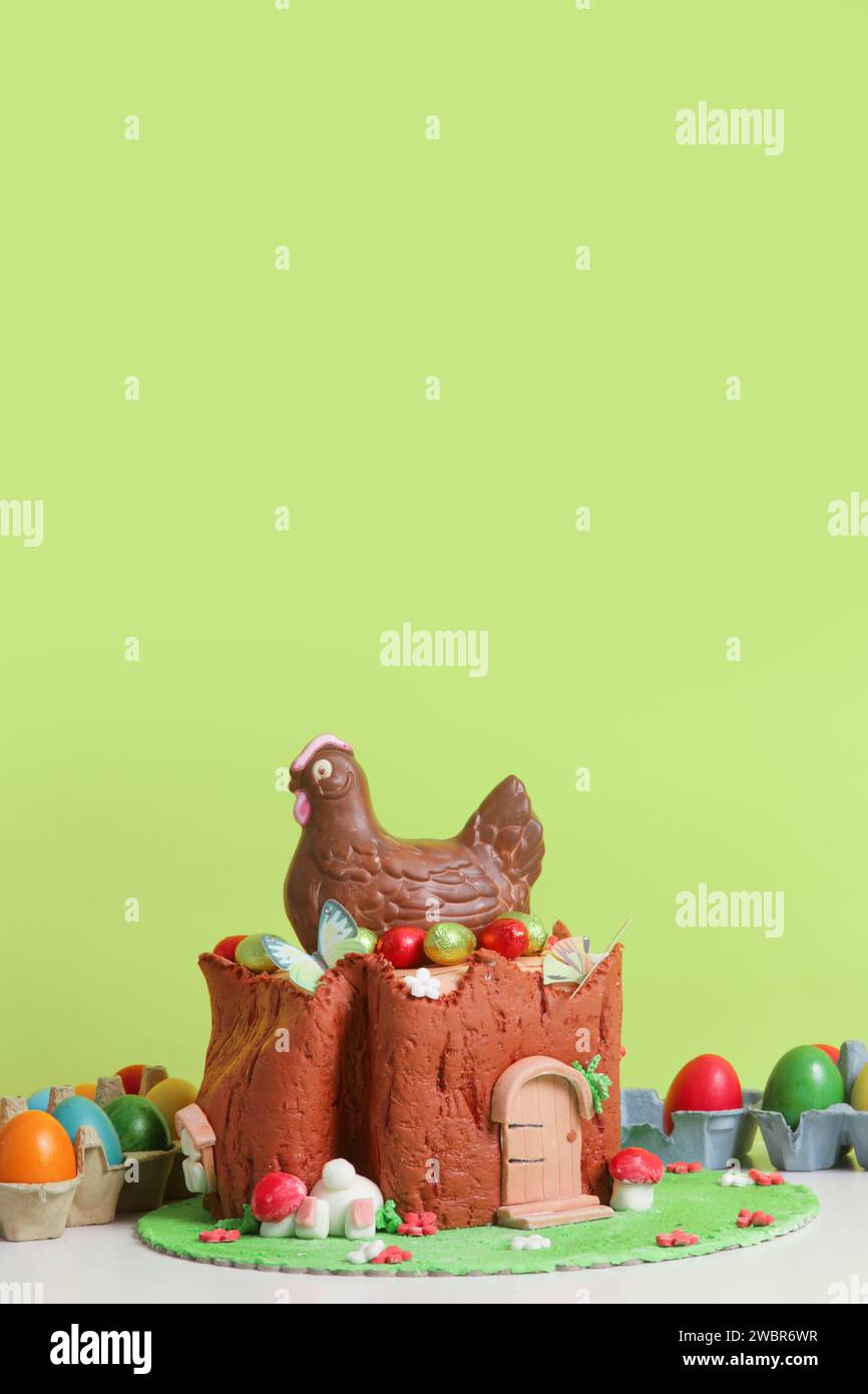 Easter log cake with textured look on the tree trunk and Easter bunny Stock Photo
