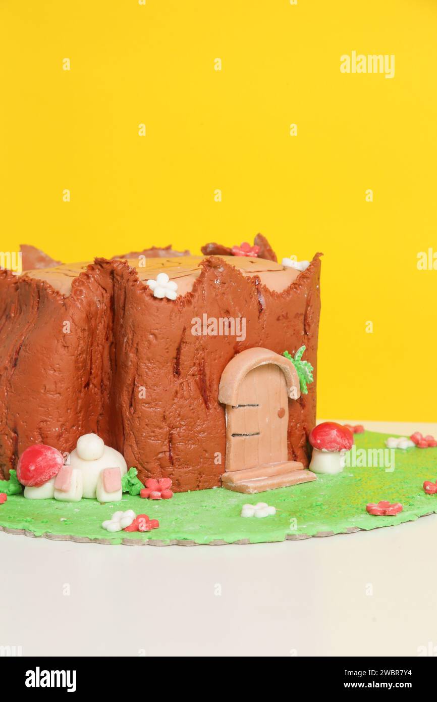 Easter log cake with textured look on the tree trunk and Easter bunny Stock Photo